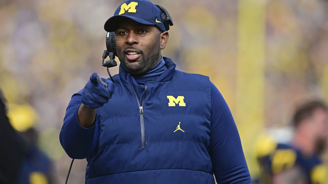 Michigan faces heavy NCAA sanctions; Coach Moore suspended but